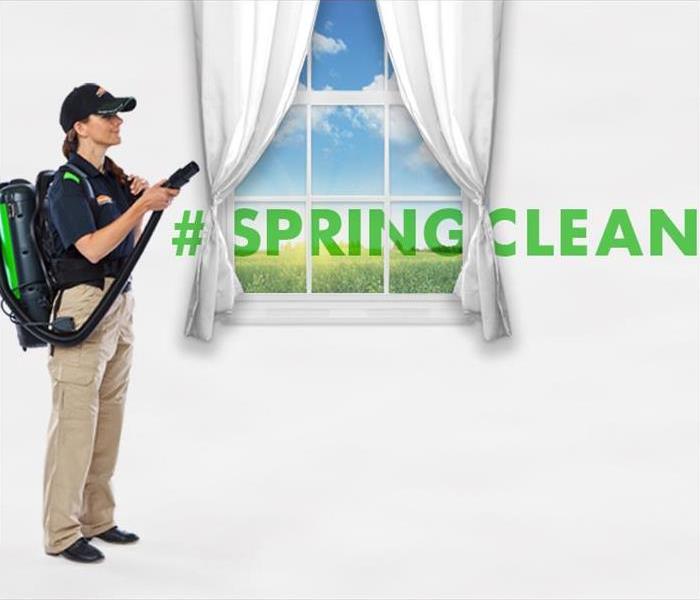 SERVPRO employee cleaning drapes "#springcleaning"